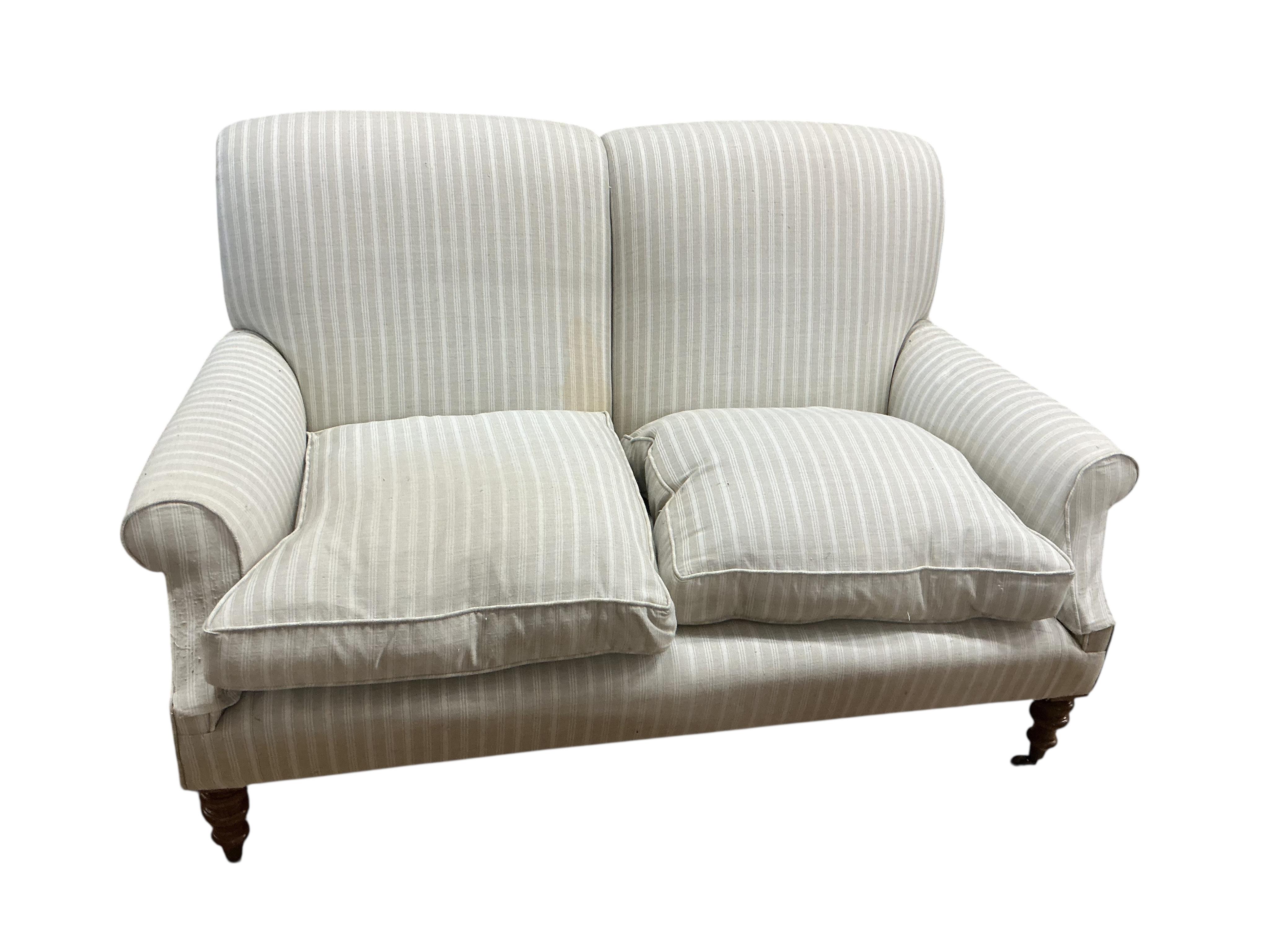A Victorian style two seater sofa in the style of Howard & Sons, width 150cm, depth 90cm, height 88cm